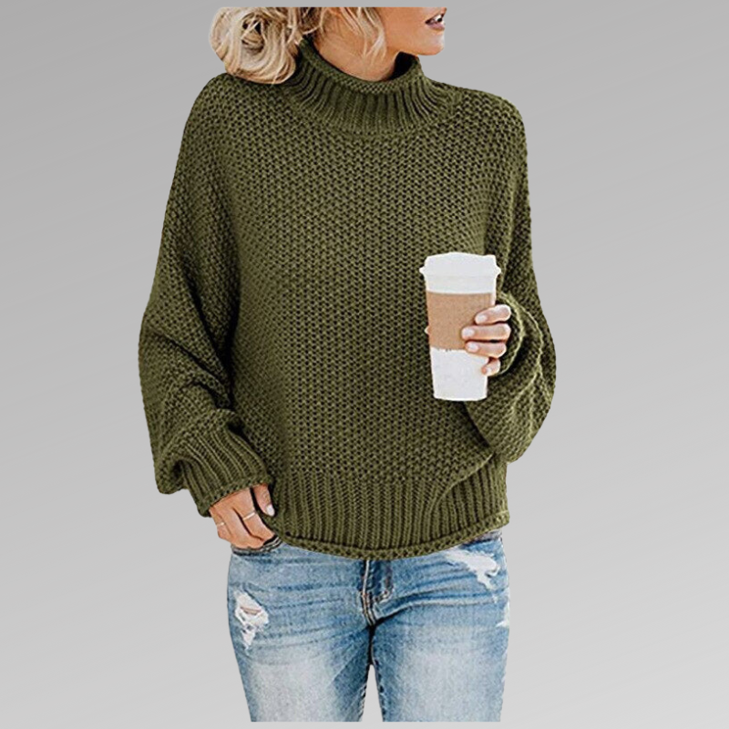 Woman in an olive green knit sweater with a coffee cup, wearing ripped jeans. Fall fashion trend, casual look, cozy knit, street style.